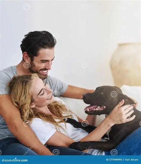 Couple relaxing on couch with dog